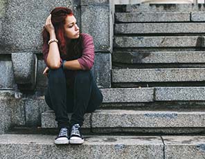 Sad teenage girl outside
